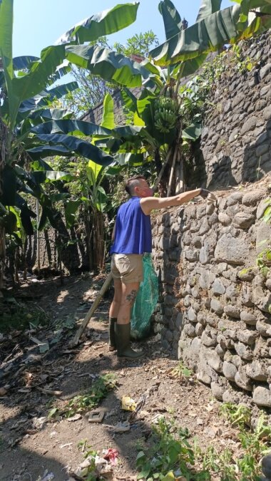 Sarah Simone cleaning a river bank in Bali